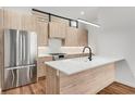 Well-lit kitchen features light wood cabinets, stainless steel appliances, and a white marble countertop at 105 Georgia Se Ave # 4, Atlanta, GA 30312
