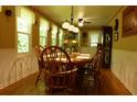 Cozy dining room with wood table, chair set and natural light from the surrounding windows at 259 Gramling Trl, Canton, GA 30114