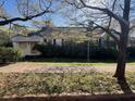 Traditional-style home with mature tree in the front yard at 5121 Newark Ave, Clarkdale, GA 30111