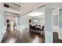 Elegant dining room with hardwood floors and decorative wall trim at 5445 Whisper Ct, Cumming, GA 30028