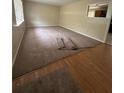 Spacious room with a window, new carpet, and a view into the kitchen at 213 Peartree Ln, Riverdale, GA 30274