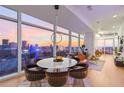 Open living and dining area with floor-to-ceiling windows offering breathtaking city skyline views at 45 Ivan Allen Jr Nw Blvd # 2505, Atlanta, GA 30308