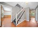 Foyer with hardwood floors, staircase, and view into multiple rooms at 1237 Hunters Dr, Stone Mountain, GA 30083