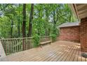 Spacious wooden deck overlooking a private, wooded backyard with mature trees at 1215 Vista Leaf Dr, Decatur, GA 30033