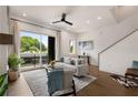 Well-lit living room featuring modern decor, wood floors, and a large balcony with sliding glass doors at 2347 Hosea L Williams Ne Dr # 11, Atlanta, GA 30317