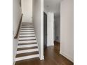 Bright entryway reveals an open staircase with wood accents and hardwood floors at 2347 Hosea L Williams Ne Dr # 11, Atlanta, GA 30317