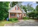 Charming home with a welcoming front porch and well-maintained landscaping at 3135 Washington Rd, Atlanta, GA 30344