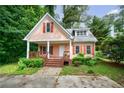 Charming home with a welcoming front porch and well-maintained landscaping at 3135 Washington Rd, Atlanta, GA 30344