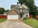 Charming two-story brick home with green shutters, lush lawn, and a two-car garage at 4424 High Gate Nw Dr, Acworth, GA 30101
