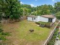 Expansive fenced backyard featuring a wooden deck, lush lawn, and mature trees, perfect for entertaining at 2123 Drew Valley Ne Rd, Brookhaven, GA 30319