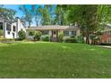 Beautiful home featuring a lush green lawn and inviting front entrance at 251 Beverly Ne Rd, Atlanta, GA 30309
