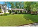 Inviting home featuring a well-maintained lawn and lush landscaping at 251 Beverly Ne Rd, Atlanta, GA 30309