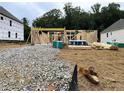 Image shows the beginning stages of the building of a home with lumber and other materials present at 727 Crest Line Trl, Powder Springs, GA 30127