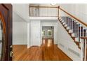 Bright foyer with hardwood floors, staircase, and second-story overlook at 912 Chipley Ct, Marietta, GA 30062