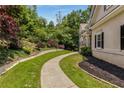 Landscaped side yard with retaining wall and walkway to home at 912 Chipley Ct, Marietta, GA 30062