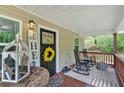 Relaxing front porch featuring comfortable seating, decorative accents, and a charming outdoor space at 428 Hulseytown Rd, Dallas, GA 30157