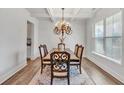 Elegant dining room features modern chandelier, neutral walls, and large window at 90 Citrine Way, Acworth, GA 30101