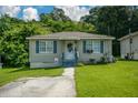 Well-kept single-story home with a neat lawn, inviting entrance, and a welcoming atmosphere at 511 Reid St, Villa Rica, GA 30180