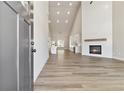 Bright, open floor plan with hardwood floors, fireplace, tall ceilings, and views of the kitchen at 2080 Cactus Ln, Cumming, GA 30040