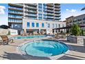 Relaxing pool area with lounge chairs and a whirlpool, perfect for unwinding at 2277 Peachtree Ne Rd # 302, Atlanta, GA 30309