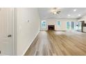 Spacious living room showcasing new floors, fireplace, and access to the backyard at 1792 Portwest Way, Hampton, GA 30228