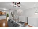 Open concept living area with hardwood floors flowing into the kitchen at 1529 Liberty Nw Pkwy # 2314, Atlanta, GA 30318