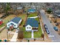 Charming home boasts a manicured lawn and a welcoming front porch with stylish curb appeal at 1375 Miller Reed Se Ave, Atlanta, GA 30315