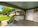 Inviting covered front porch with painted wood and steps leading to the front door at 1770 Rockland Se Dr, Atlanta, GA 30316