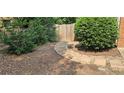 The backyard features a stepping stone pathway and privacy fence at 2123 Condor Dr, Lawrenceville, GA 30044