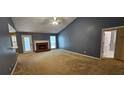 Spacious living room with fireplace and neutral carpet at 2123 Condor Dr, Lawrenceville, GA 30044
