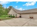 Exterior view showcasing the ample three-car garage and well-maintained surroundings at 2384 Tree Arbor Way, Marietta, GA 30064
