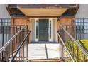Inviting entryway with covered porch and well-maintained stairs, adding curb appeal to the property at 365 Winding River Dr # E, Atlanta, GA 30350