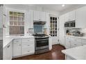 Bright kitchen with white cabinets, stainless steel appliances, and a window with natural light at 124 Lafayette Ne Dr # 4, Atlanta, GA 30309