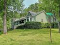 Beautiful home with lush green lawn and mature trees on a corner lot at 4812 Shallow Creek Nw Dr, Kennesaw, GA 30144