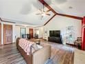 Spacious living room features vaulted ceilings, exposed beams, and stylish decor at 4812 Shallow Creek Nw Dr, Kennesaw, GA 30144