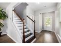 Inviting foyer with hardwood floors and staircase at 1295 Aster Ives Dr, Lawrenceville, GA 30045