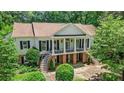 Elevated view of home with columns and manicured greenery at 5545 Cross Gate Ct, Atlanta, GA 30327