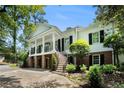 Stately white home with columns, a dual staircase, and black shutters at 5545 Cross Gate Ct, Atlanta, GA 30327