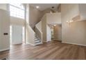 Open living room featuring hardwood floors, a staircase, and lots of natural light at 3984 Oak Glenn Dr, Duluth, GA 30096