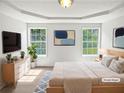 Beautiful bedroom with tray ceiling, and large windows overlooking a well-manicured yard at 6560 Alford Way, Lithonia, GA 30058