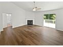 Bright living room with fireplace and sliding glass doors to a deck at 6560 Alford Way, Lithonia, GA 30058