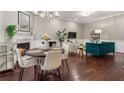 Inviting living space with fireplace, chandelier, and a stylish teal couch at 893 Piedmont Ne Ave # 3, Atlanta, GA 30309