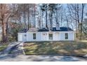 Charming single-story home with light blue siding, white trim, and a well-maintained front yard at 2216 Marbut Farms Trce, Lithonia, GA 30058