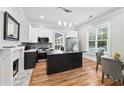 Modern kitchen with stainless steel appliances, an island, and a cozy dining area at 50 Ormond Sw St, Atlanta, GA 30315