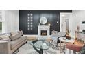 Elegant living room with a fireplace, stylish decor, and plenty of natural light at 50 Ormond Sw St, Atlanta, GA 30315