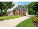 Beautiful home with an expansive driveway and lush green lawn in a peaceful neighborhood at 6061 Meridian Nw Dr, Acworth, GA 30101