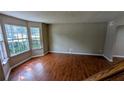 Bright living room featuring hardwood floors and large windows providing natural light at 315 Marley Dr, Atlanta, GA 30349