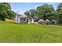 Wide front yard with beautifully renovated house and wood fence at 528 Allendale Dr, Decatur, GA 30032