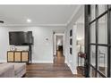 Open-concept living room with hardwood floors, modern decor and bright lighting at 528 Allendale Dr, Decatur, GA 30032