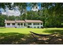 Beautiful home with front porch and hammock at 871 Cowan Se Rd, Conyers, GA 30094